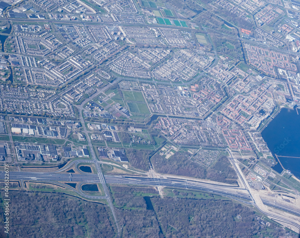 Netherlands, Holland, Dutch, Aerial view of city outskirts in the day from an aeroplane window