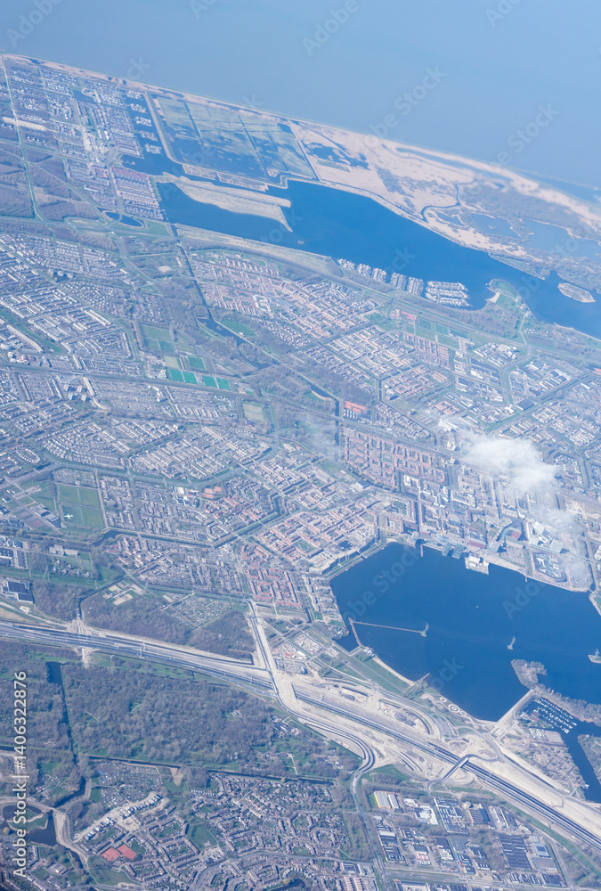 Netherlands, Holland, Dutch, Aerial view of city outskirts in the day from an aeroplane window