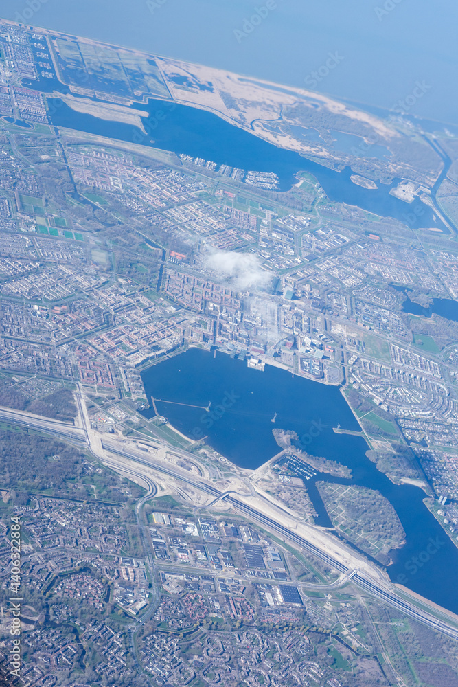 Netherlands, Holland, Dutch, Aerial view of city outskirts in the day from an aeroplane window