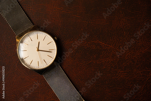 Wallpaper Mural Photograph of a watch in overhead view seen from the front on a leather background Torontodigital.ca