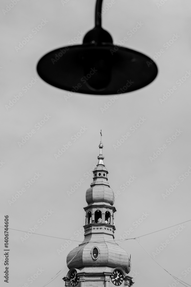 Church tower. Blurred lantern in the foreground. Katowice, Nikiszowiec. Poland