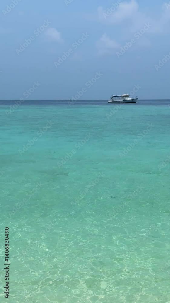 A speedboat in a lagoon in the Indian Ocean in the Maldives. Vertical video A speedboat in a lagoon in the Indian Ocean in the Maldives. Vertical video
