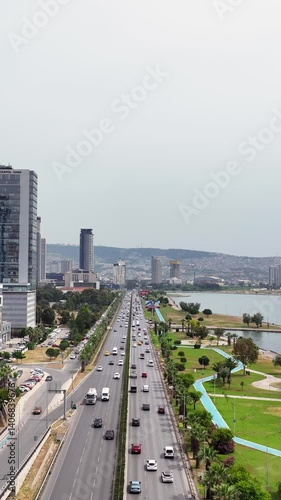 Wallpaper Mural Vertical video of vehicles in traffic - 4k video of vehicles driving on the road with a drone Torontodigital.ca