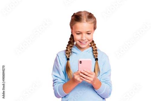 Obraz na płótnie Photo of pretty little lady holding telephone hands reading positive comments for new post wear casual blue hoodie pullover isolated pastel pink color background w salonie