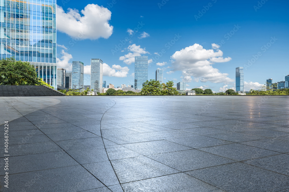 Empty square floor and cityscape with skyscraper scenery under blue sky