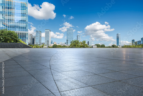 Obraz na płótnie Empty square floor and cityscape with skyscraper scenery under blue sky w salonie