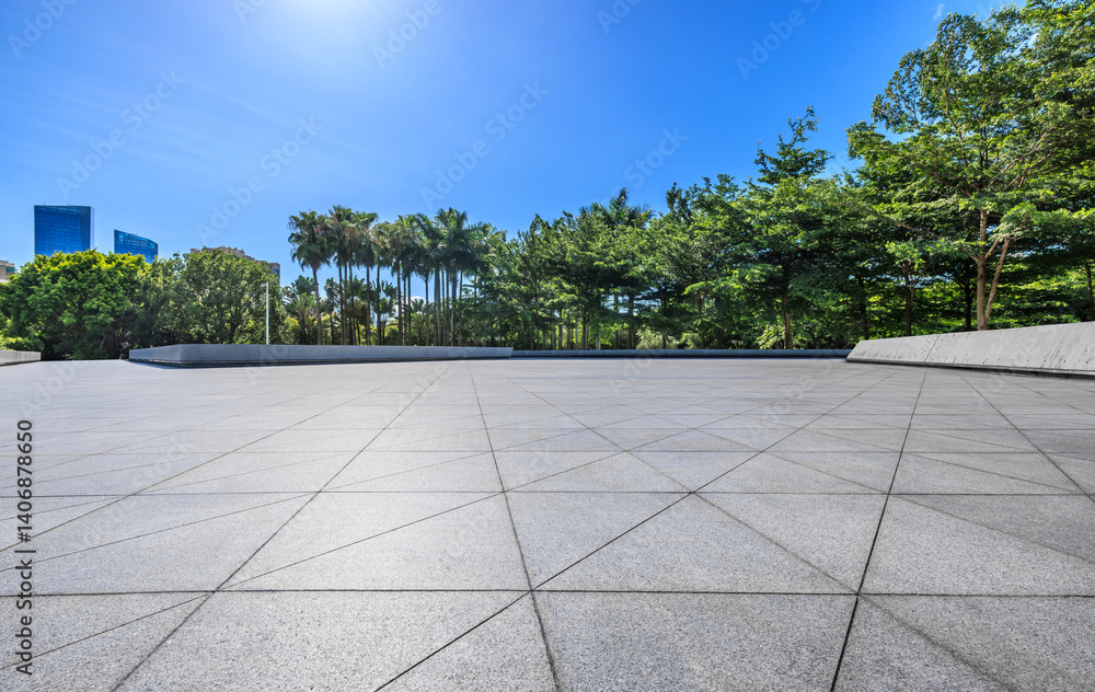 Empty square floor and green trees in city park