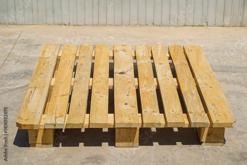 Obraz na płótnie Wooden Pallet on a Warehouse Floor with Metal Wall Background w salonie