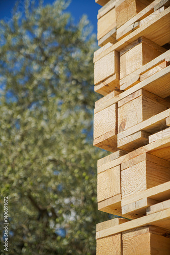 Obraz na płótnie Stacked Wooden Pallets in an Outdoor Environment Highlighting Natural Textures w salonie