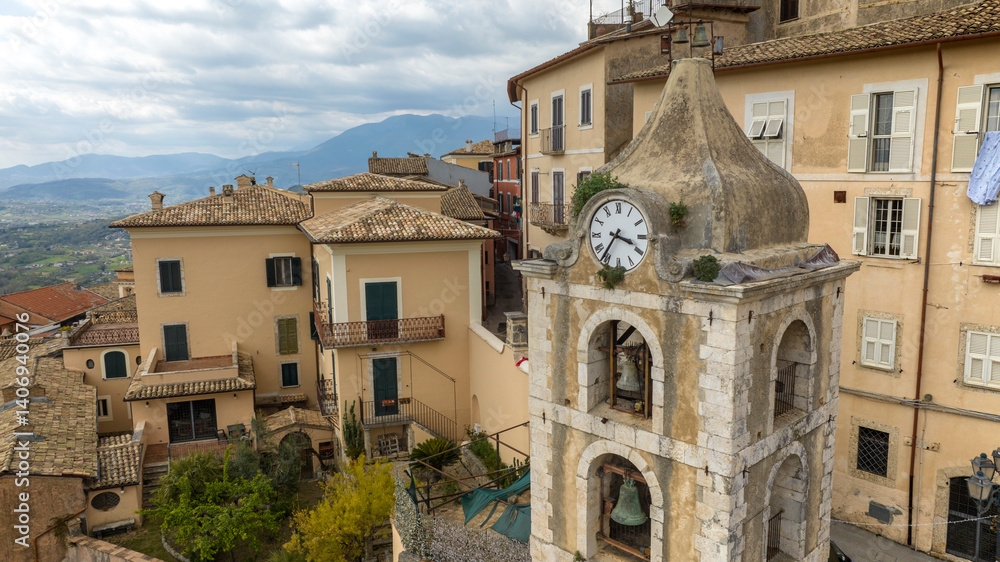 Clock on the bell tower of a church in an Italian town.