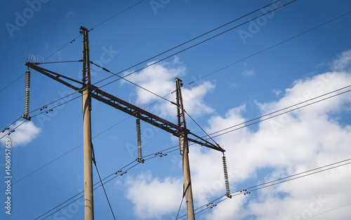 Poles with high voltage wires against the blue sky 2