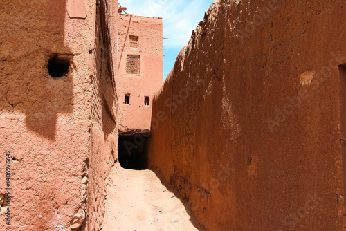old brick building, old brick wall, Ancient village, Peaceful alley, Village road, Abyaneh village, Narrow alley leading to a blue sky, Ancient village under a cloudy sky, Iran, Persian, Persia