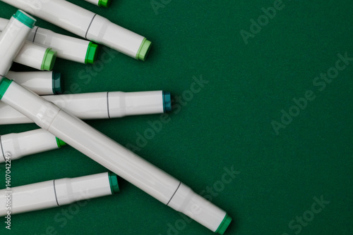 Several markers on a green background