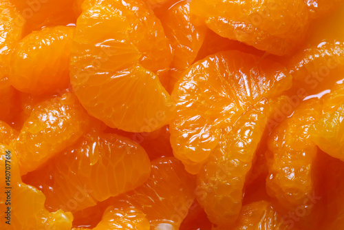 Картината върху платно Mandarin segments in juice background backdrop