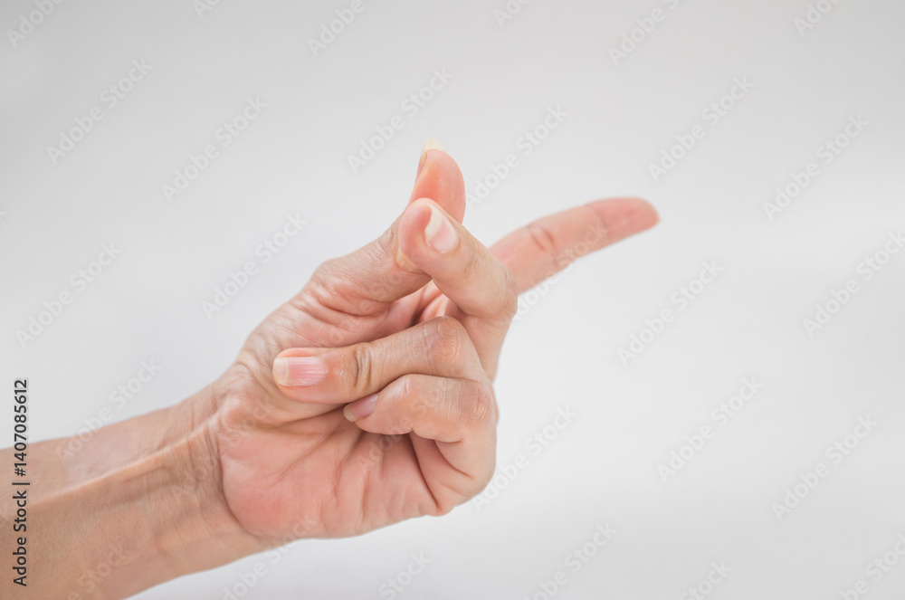 Close up of female hand showing middle finger against white background with vignette Close up of female hand showing middle finger against white background with vignette