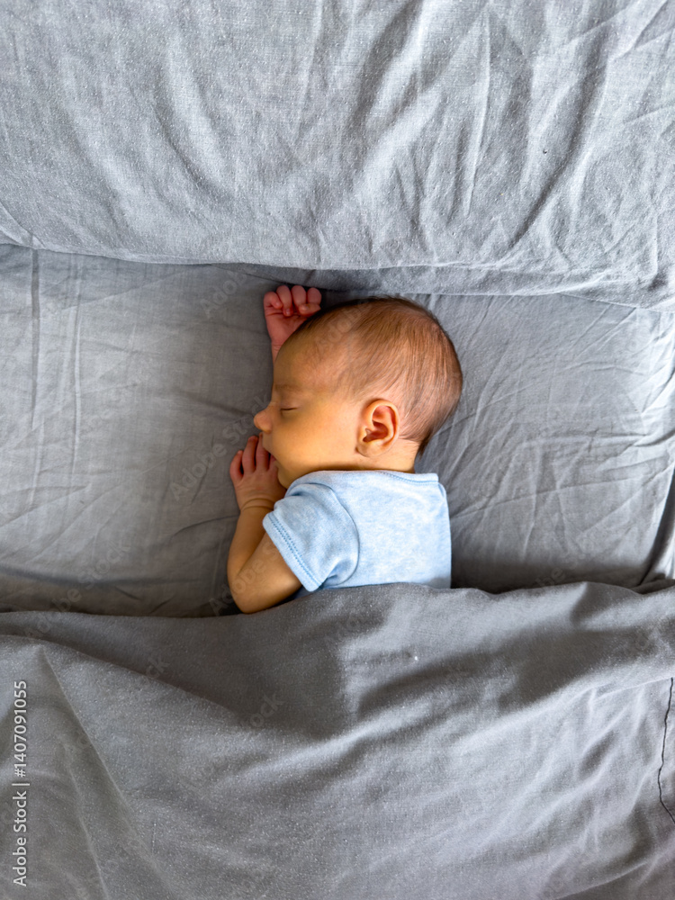 Newborn Baby Sleeping Peacefully on Bed