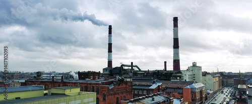 Photography tall chimneys of boiler houses that heat city.