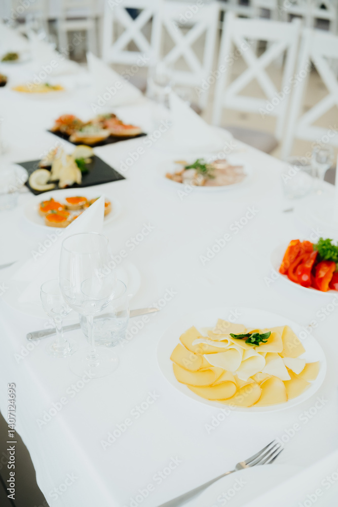 Elegant dining table set with assorted dishes and decor in bright atmosphere