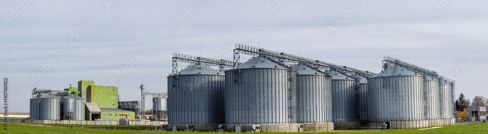 Agro silos granary elevator on agro-processing manufacturing plant for processing drying cleaning and storage of agricultural products, flour, cereals and grain. Agro silos granary elevator on agro-processing manufacturing plant for processing drying cleaning and storage of agricultural products, flour, cereals and grain.