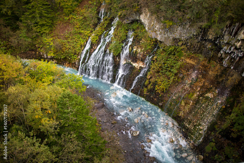 Fototapeta premium Autumn scenery of Shirogane Falls in Asahikawa, Hokkaido, Japan