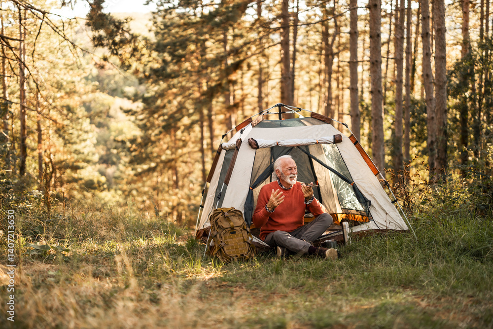 Senior Man Camping Alone in a Serene Forest Landscape