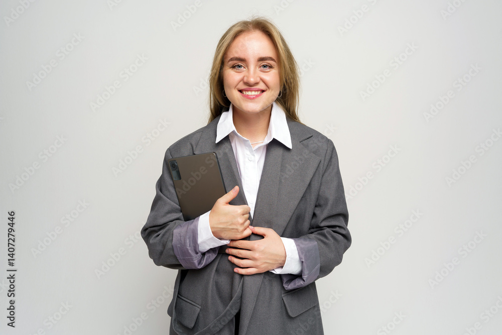 Young Professional Confidently Poses With a Tablet, Ready to Present Ideas and Inspire Collaboration Young Professional Confidently Poses With a Tablet, Ready to Present Ideas and Inspire Collaboration