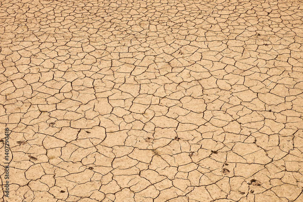 Dry cracked earth. Dry cracked earth. Dry river, Spain, Europe. Selective focus Dry cracked earth. Dry cracked earth. Dry river, Spain, Europe. Selective focus
