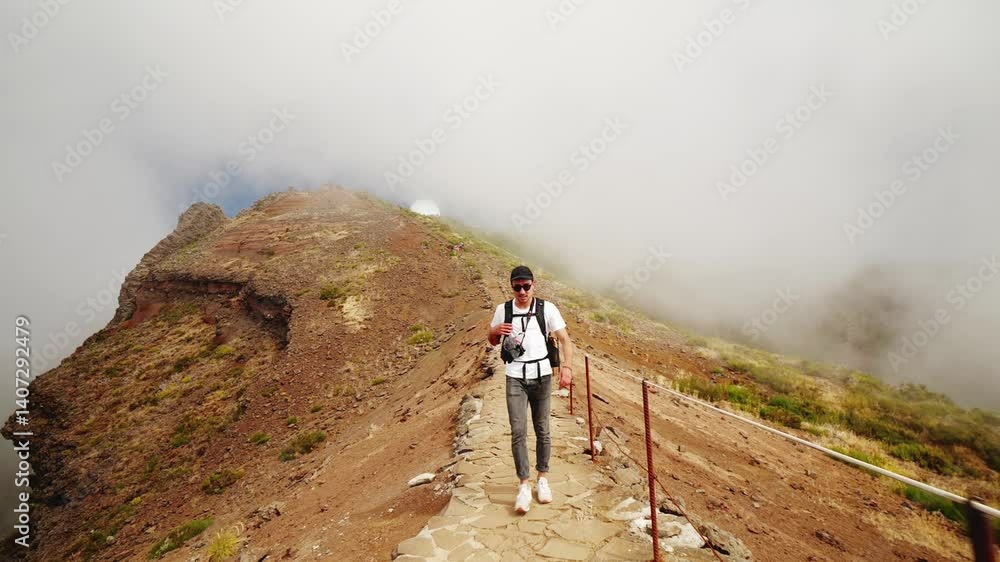 Walking along the scenic PR1 trail between Pico Ruivo and Pico Arieiro in Madeira Walking along the scenic PR1 trail between Pico Ruivo and Pico Arieiro in Madeira