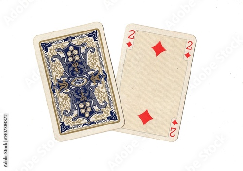 A pair of antique playing cards with one card revealed in the suit of diamonds.