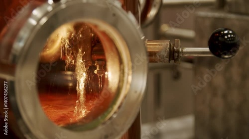 Close-Up of Copper Distillation Apparatus with Pressure Gauge and Viewing Ports