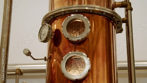 Close-Up of Copper Distillation Apparatus with Pressure Gauge and Viewing Ports