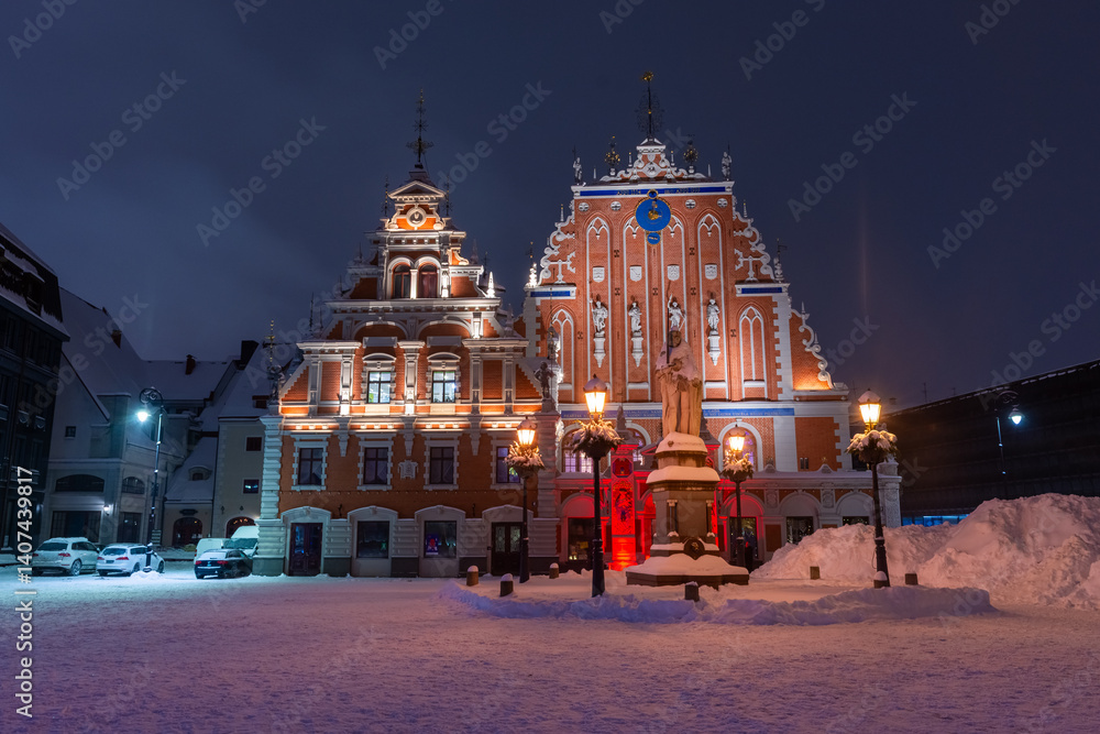 Snowy square of Riga historic center at night, Latvia