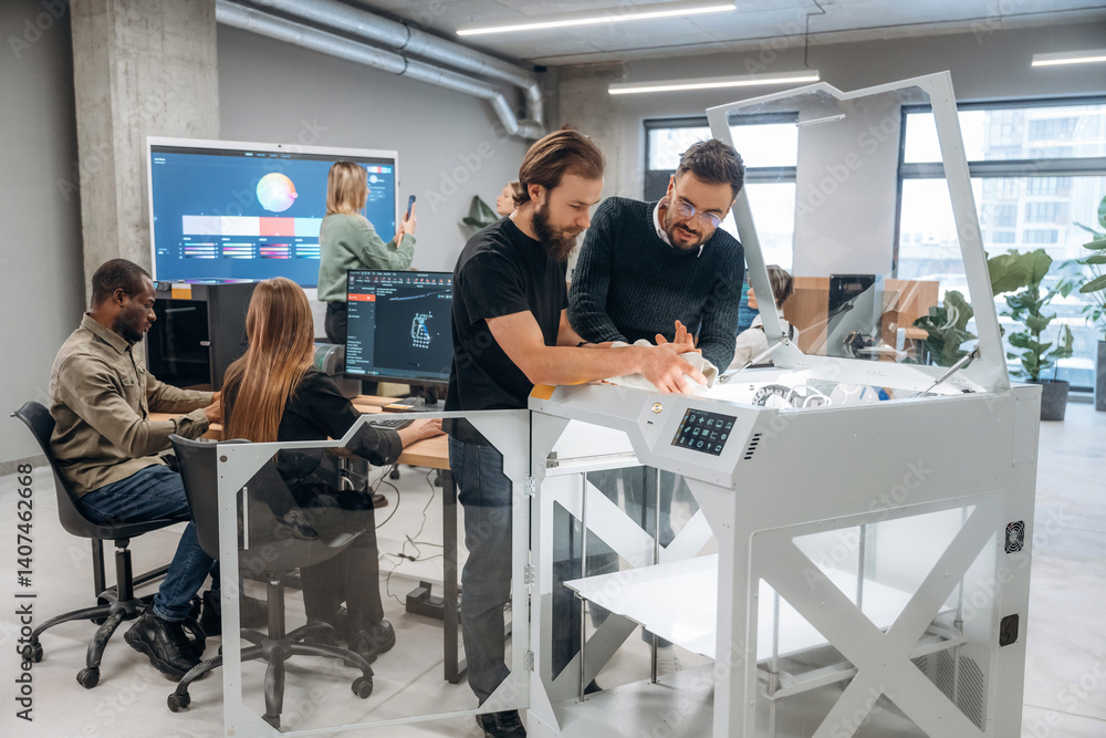 © standret - Modern technology. Standing. People are in the office by the 3d printer