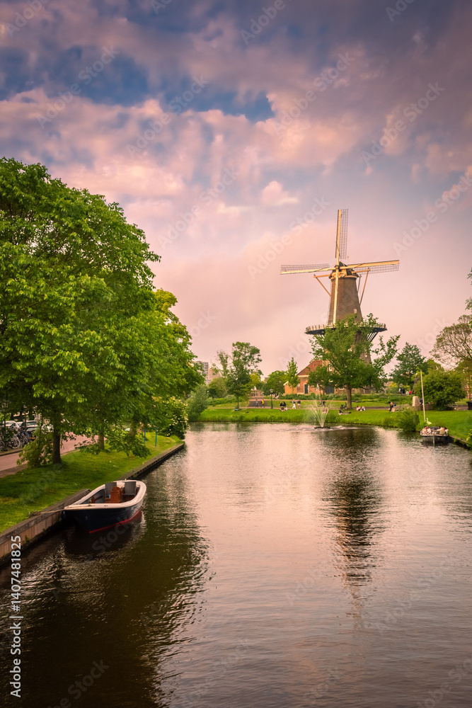 Leiden, Netherlands, windmill and canals at sunset Leiden, Netherlands, windmill and canals at sunset