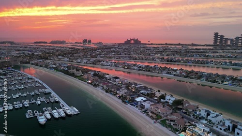 Dubai, UAE: Aerial view of capital city of Emirate of Dubai, artificial islands beach district of Palm Jumeirah - landscape panorama of Arabian Peninsula from above
