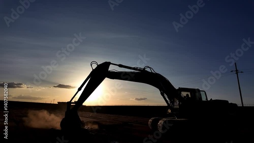 excavator at sunset