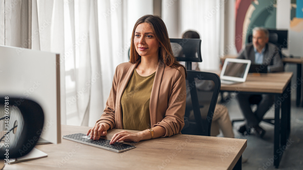 Professional Woman Working at Office Desk in a Stylish Modern Workspace
