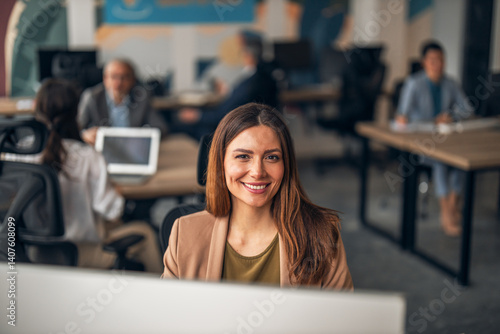 Obraz na płótnie Smiling Professional in Modern Office Environment with Colleagues w salonie