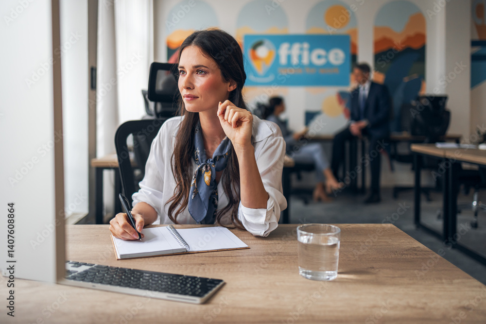 Professional Woman Focused on Task at Open Office