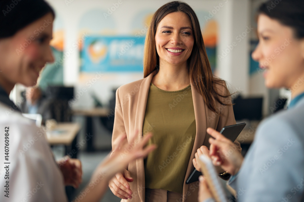 Smiling Businesswoman Engaging in Workplace Interaction with Colleagues