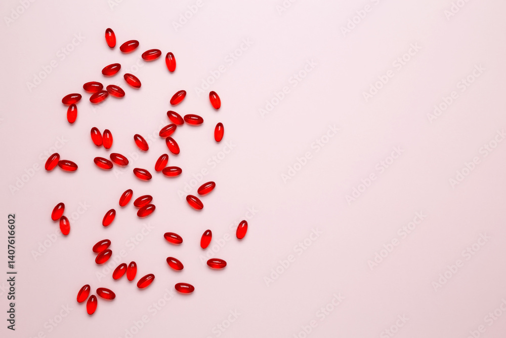 Red pills and capsules scattered. Concept of medicine, healthcare, and pharmaceutical industry Red pills and capsules scattered. Concept of medicine, healthcare, and pharmaceutical industry