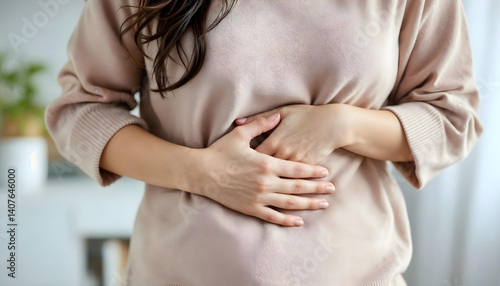 pregnant woman holding her belly