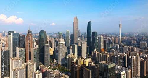 Wallpaper Mural Expansive aerial view showcasing the dense modern architecture and skyscrapers of Guangzhou's financial hub under blue sky. Torontodigital.ca