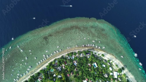 Aerial top view of tropical island Balicasag surrounded by turquoise waters and coral reefs, Philippines, 4k