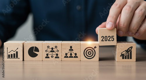 Planning 2025 goals business strategy growth teamwork and targets Wooden blocks with icons