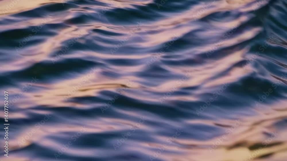 Mesmerizing reflections on rippling water surface in golden hour light