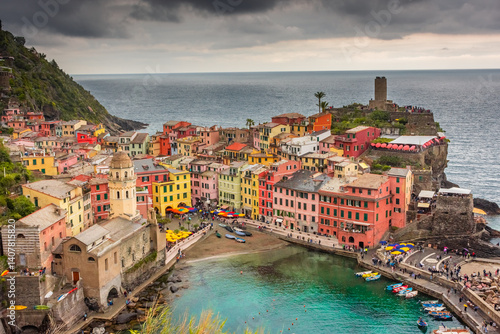 View of the colorful town of Vernazza under a cloudy sky, Cinque Terre, Liguria,  Italy