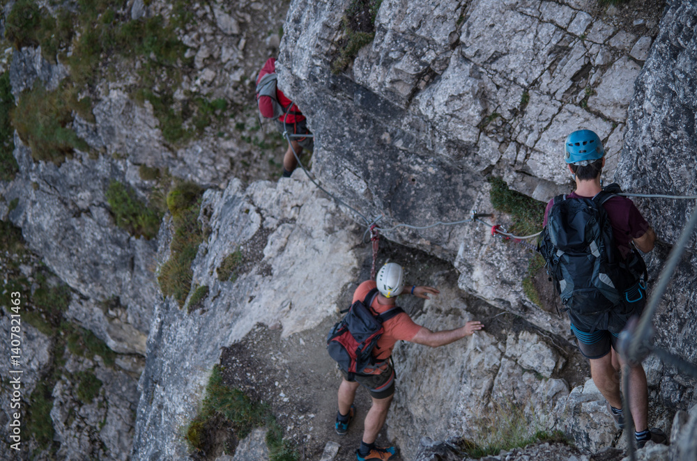 Three mountaineers at a via ferrata in Bavaria Three mountaineers at a via ferrata in Bavaria