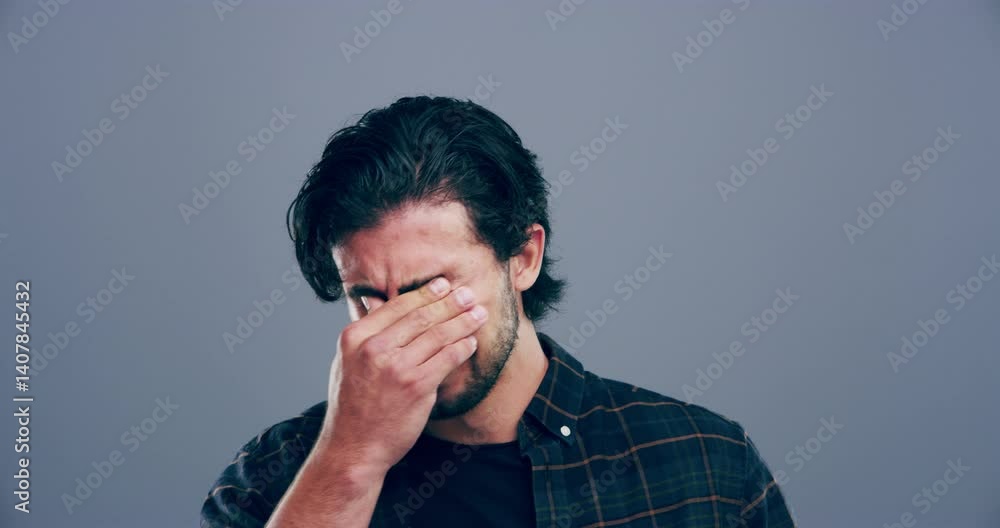 Man, crying and hand for sad with depression, anxiety and mental illness with stress by gray background. Young, italy and person for broken heart, frustrated and loss in break up in studio mockup Man, crying and hand for sad with depression, anxiety and mental illness with stress by gray background. Young, italy and person for broken heart, frustrated and loss in break up in studio mockup