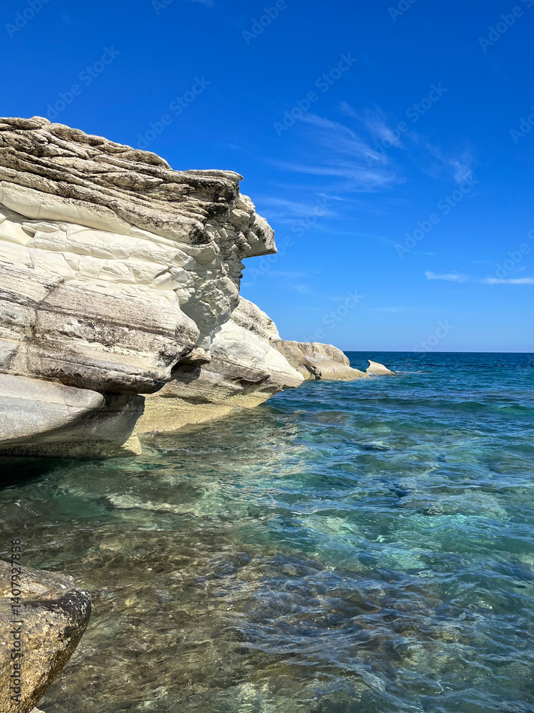 Naklejka premium Rocks in the sea. Mediterranean coast. A place to walk with a sea view. Cyprus